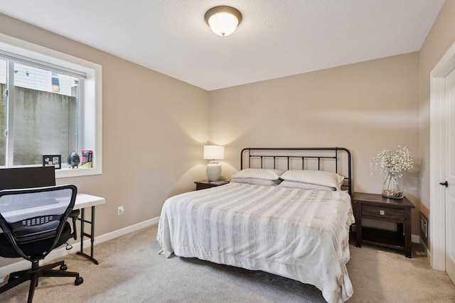 bedroom with carpet and baseboards