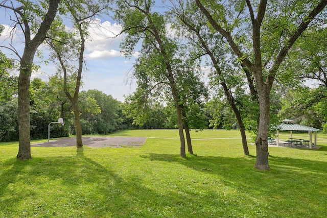 view of yard with community basketball court and a gazebo