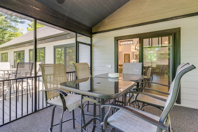 sunroom with lofted ceiling