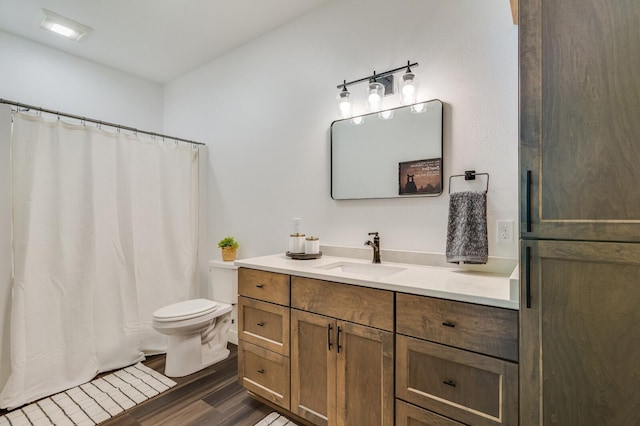 2568 28 1/4 St, Cedar Lake Twp, WI 54817 - full bathroom with curtained shower, wood finished floors, toilet, and vanity