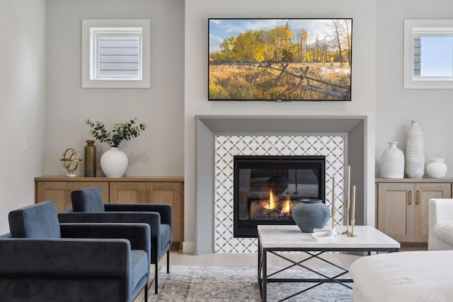 sitting room with a tile fireplace