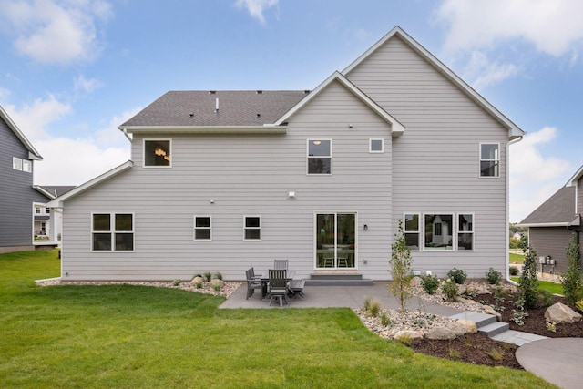 back of property featuring a patio and a yard