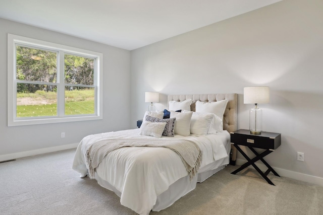 bedroom featuring carpet flooring, baseboards, and visible vents