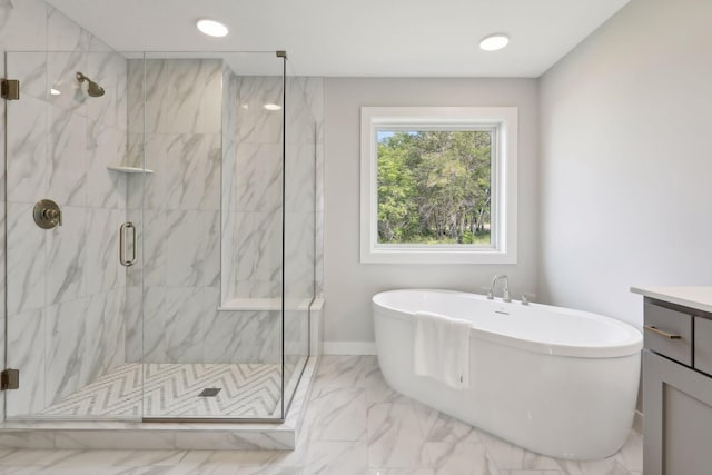 bathroom featuring a marble finish shower, baseboards, a soaking tub, marble finish floor, and vanity