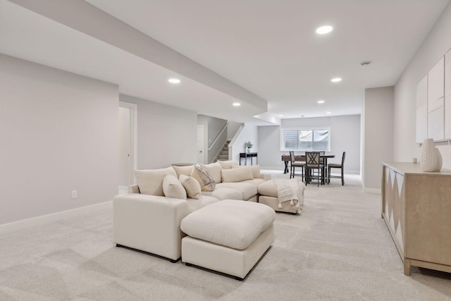 living room with light carpet, recessed lighting, stairs, and baseboards