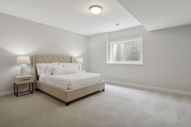 carpeted bedroom featuring baseboards