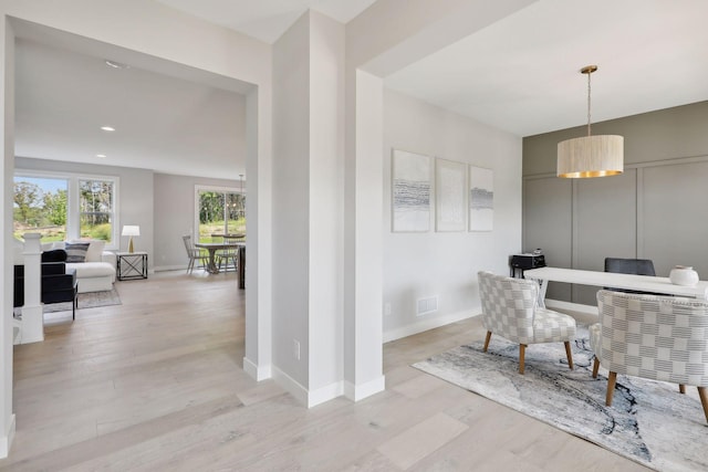 dining area with recessed lighting, light wood-type flooring, baseboards, and visible vents