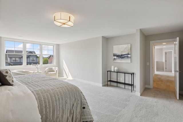 carpeted bedroom with baseboards