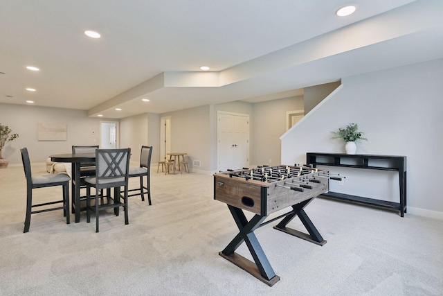 game room with recessed lighting, light colored carpet, and baseboards