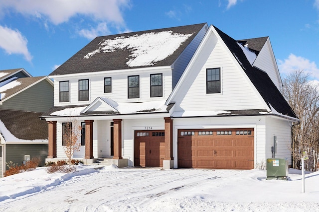 modern inspired farmhouse with a garage and central AC