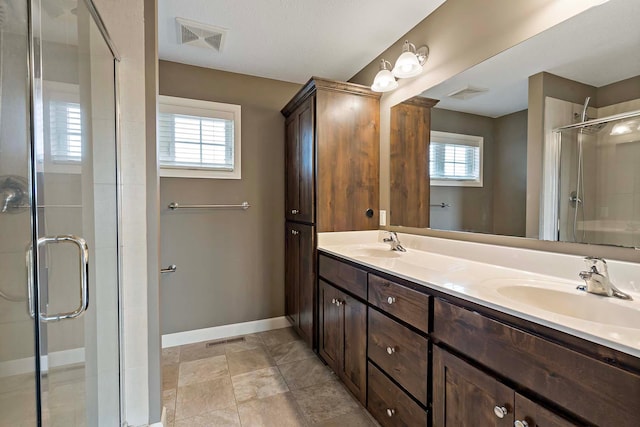 bathroom with vanity and an enclosed shower