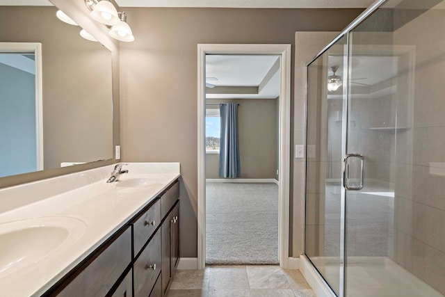 bathroom featuring vanity and a shower with shower door