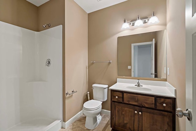 bathroom with vanity, tile patterned flooring, a shower, and toilet