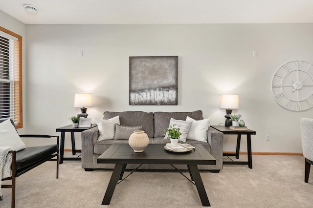 living room with baseboards and light colored carpet