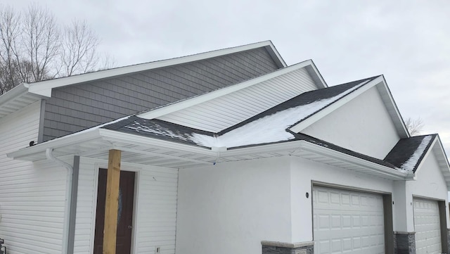 view of side of property with a garage