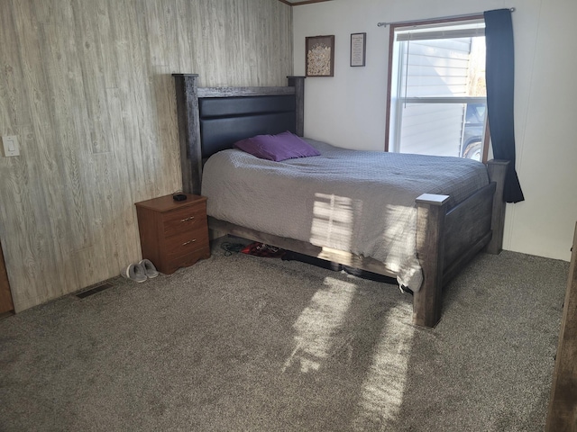 carpeted bedroom featuring visible vents