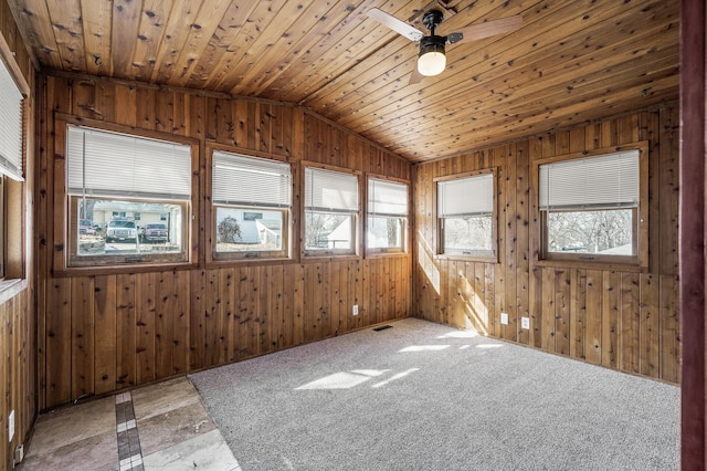 unfurnished sunroom featuring wooden ceiling, plenty of natural light, visible vents, and vaulted ceiling