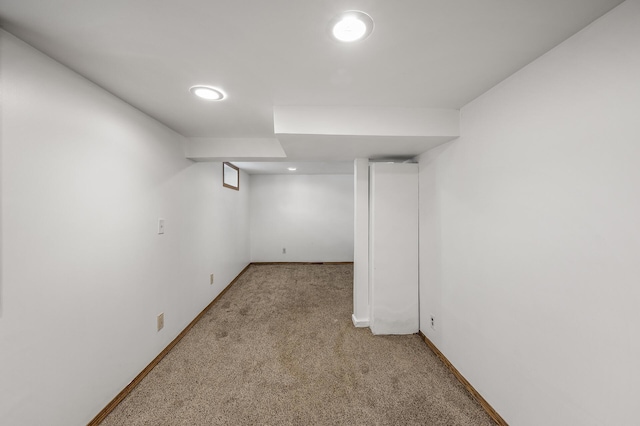 finished below grade area featuring carpet and baseboards