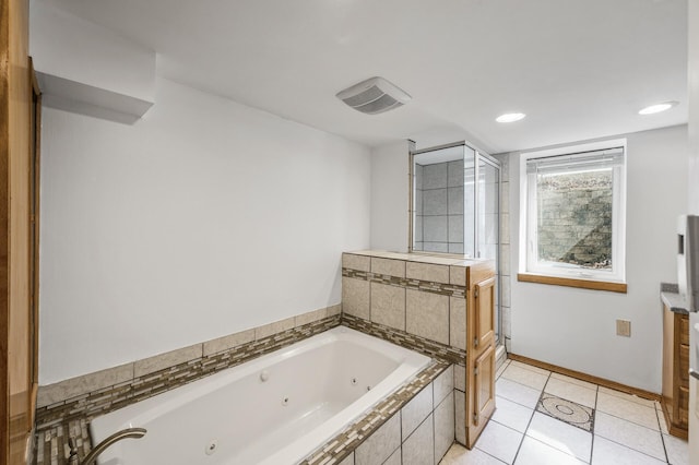 bathroom featuring visible vents, baseboards, a stall shower, tile patterned floors, and a tub with jets