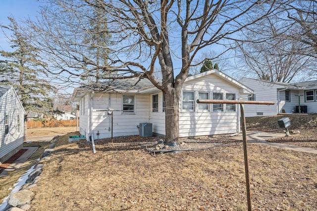 view of side of property with central AC unit