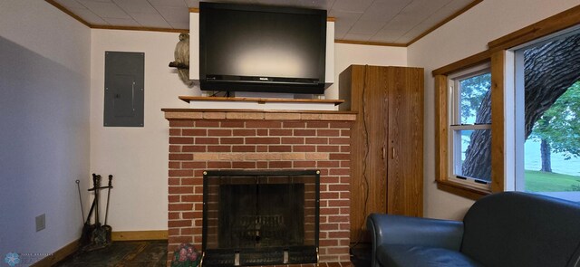 living room with ornamental molding, a fireplace, electric panel, and baseboards