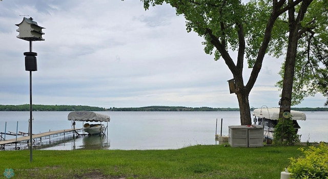 dock area with a water view and boat lift