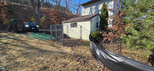 view of home's exterior featuring fence