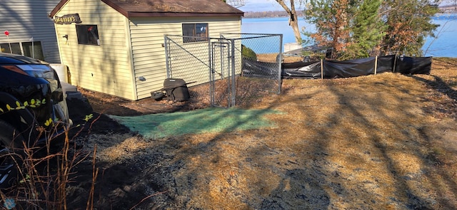 view of side of home featuring fence