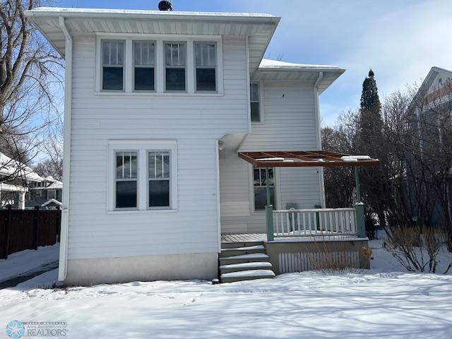 view of snow covered house