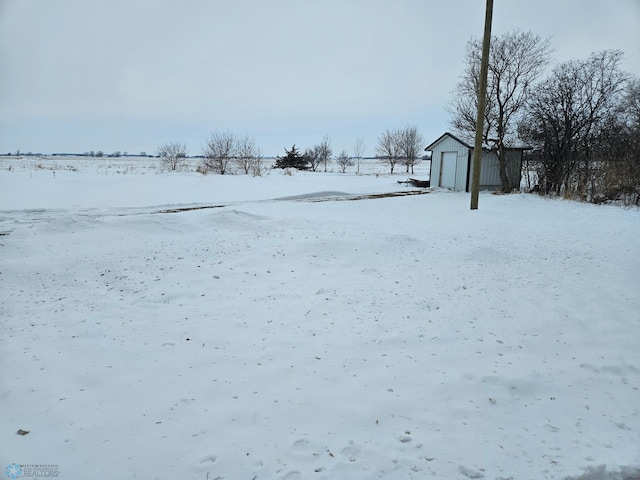 snowy yard with a storage unit