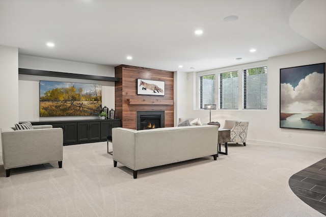 living room featuring light carpet and a fireplace