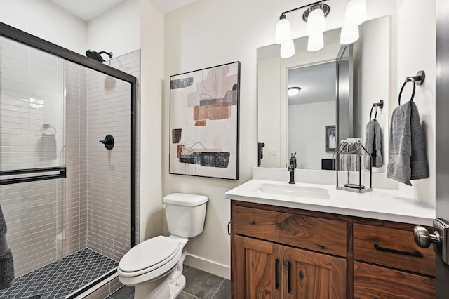 bathroom featuring a shower with door, vanity, and toilet