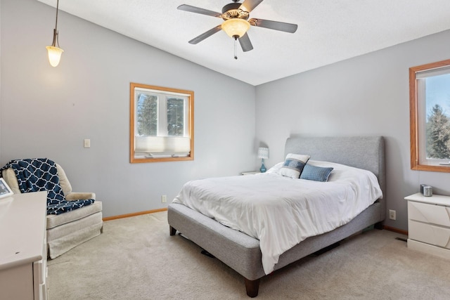 carpeted bedroom featuring vaulted ceiling and ceiling fan