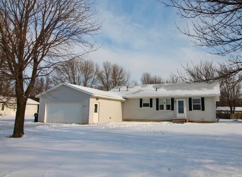 single story home with a garage