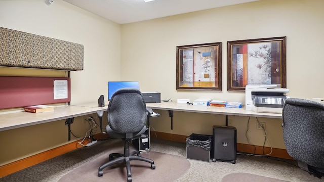 office area with baseboards and built in study area