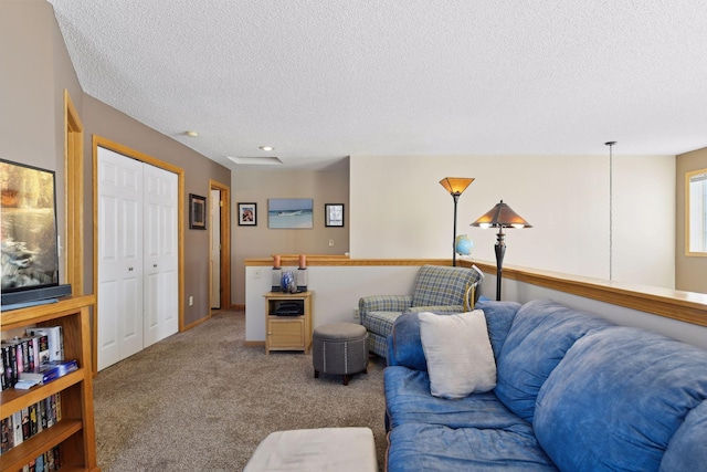 living room with carpet and a textured ceiling