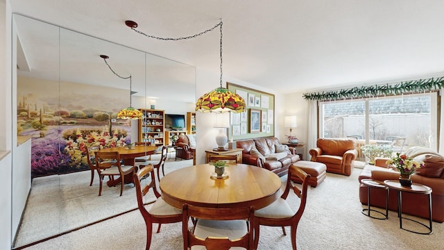 dining room with light colored carpet