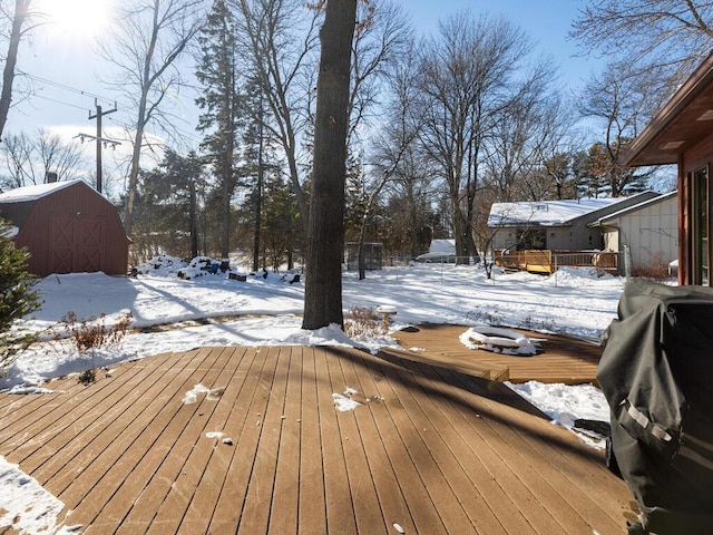 snow covered deck with grilling area