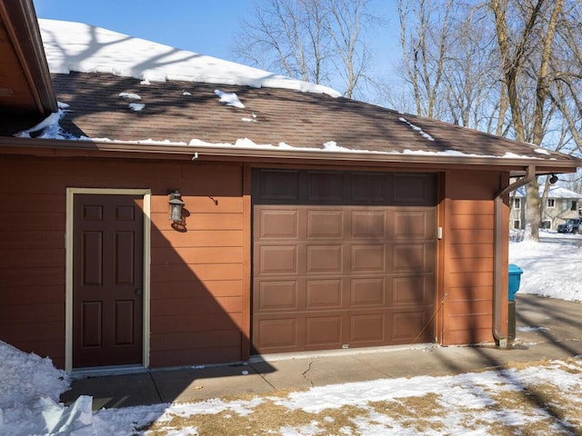 view of snow covered garage