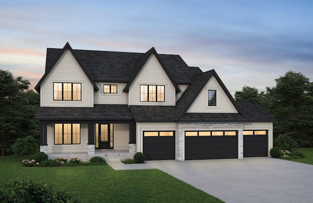 view of front of house with a lawn, driveway, a shingled roof, and an attached garage