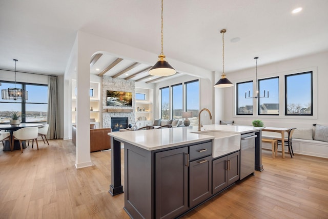 4718 Ordell Trl N, Stillwater, MN 55082 - kitchen with a sink, open floor plan, dishwasher, light countertops, and a chandelier