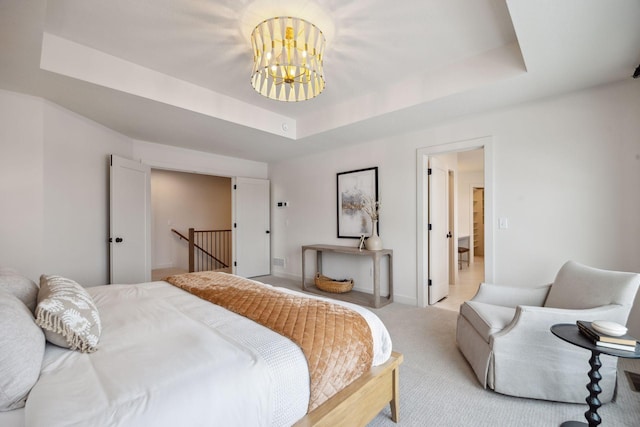 4718 Ordell Trl N, Stillwater, MN 55082 - carpeted bedroom with a raised ceiling, a chandelier, and baseboards