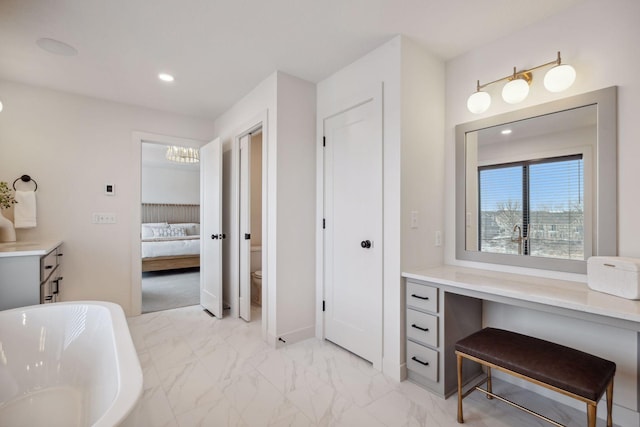 4718 Ordell Trl N, Stillwater, MN 55082 - ensuite bathroom with a soaking tub, toilet, marble finish flooring, a chandelier, and recessed lighting