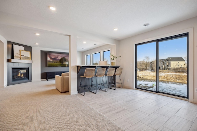 4718 Ordell Trl N, Stillwater, MN 55082 - living room featuring baseboards, a fireplace, and recessed lighting