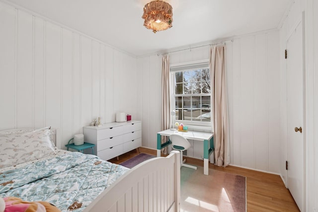 bedroom with wood finished floors