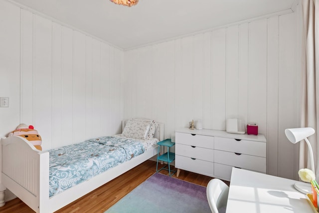 bedroom with dark wood-type flooring