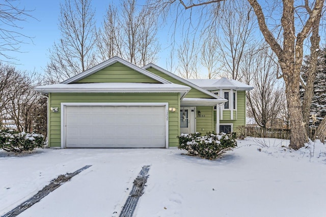 single story home featuring a garage