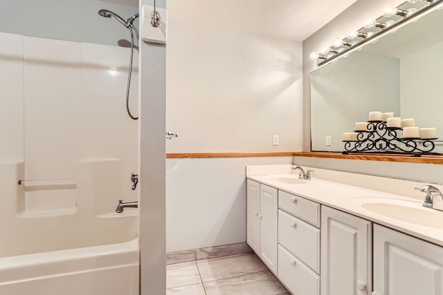 bathroom featuring vanity and washtub / shower combination