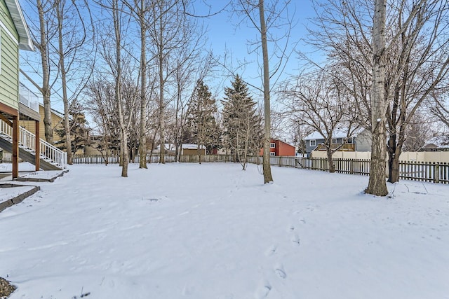 view of yard layered in snow