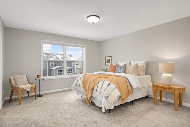 carpeted bedroom featuring a textured ceiling